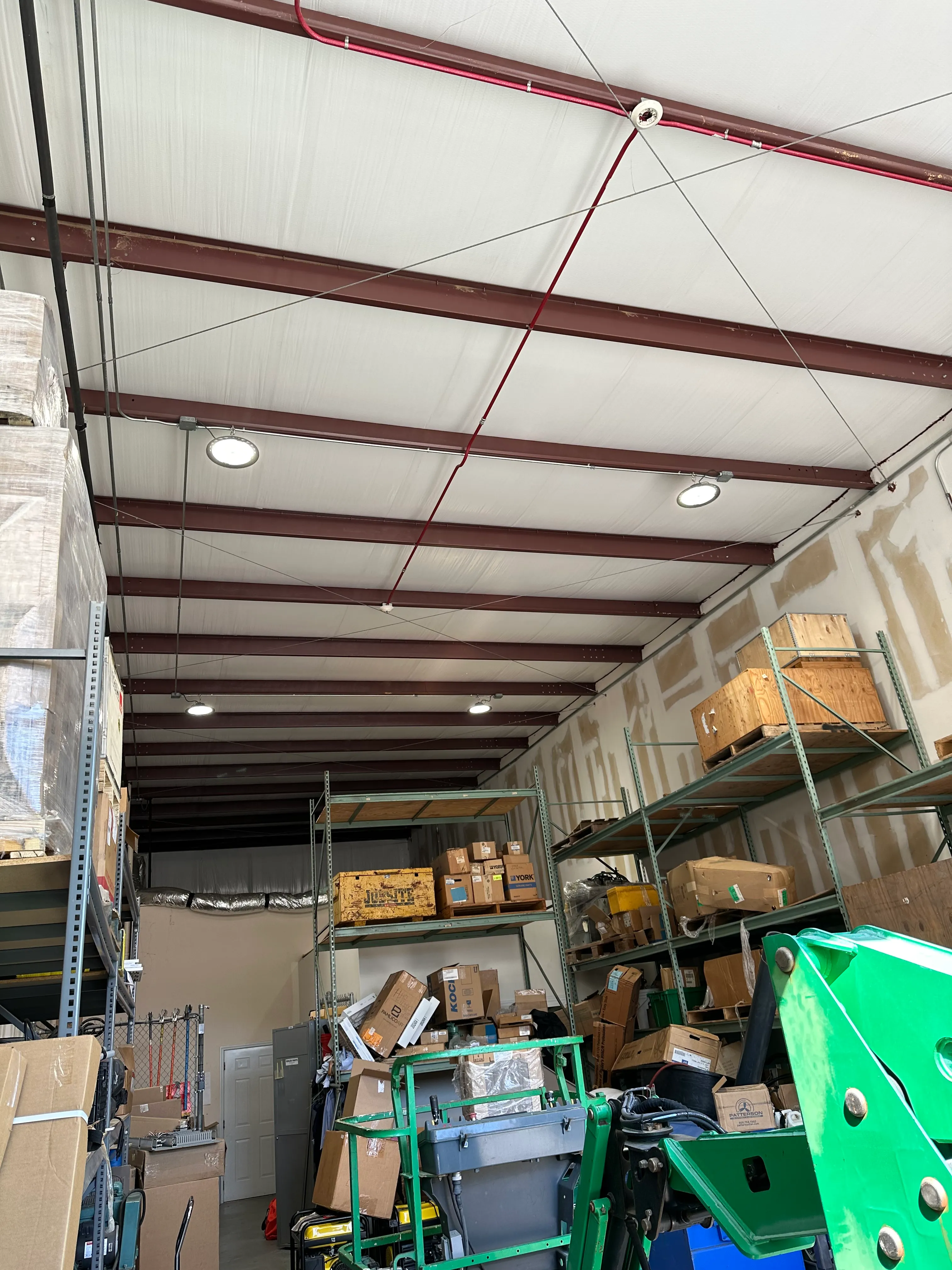 Illuminated high-bay fixtures in a commercial storage building
